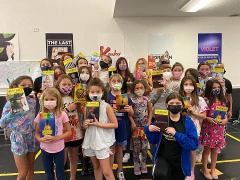 a group of children wearing masks