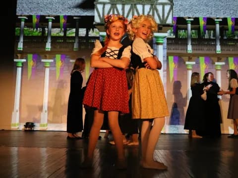 a couple of women dancing