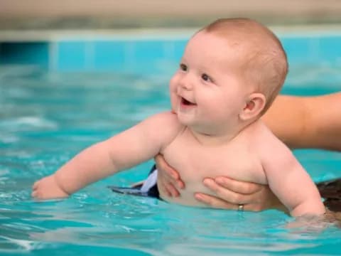 a baby in a pool