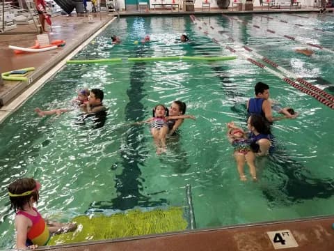 a group of people in a pool
