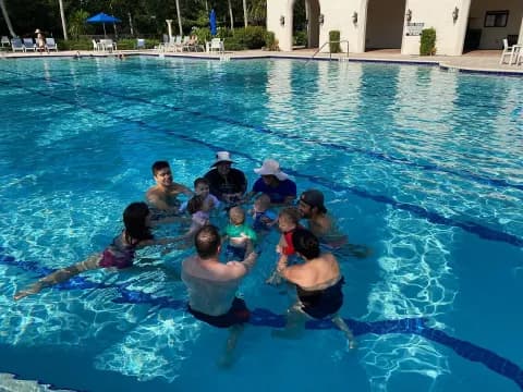 a group of people in a pool