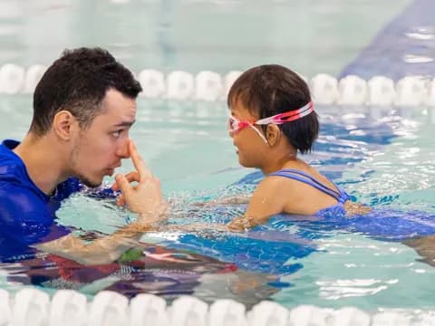 a man and a woman in a pool