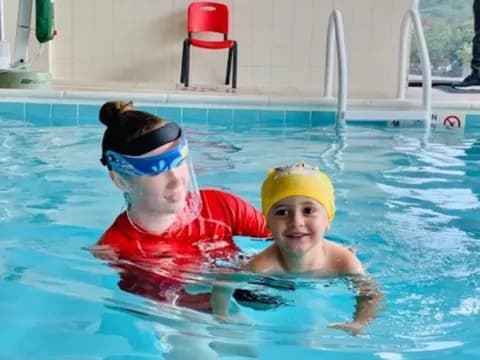 a couple of people in a pool