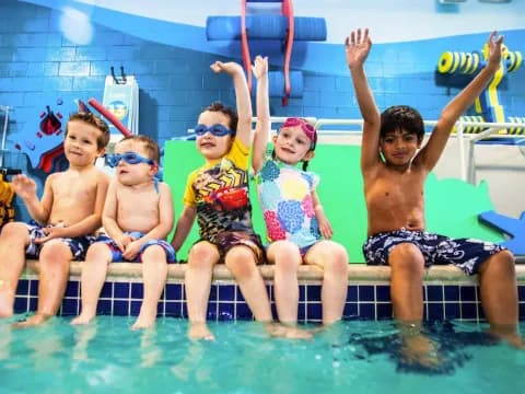 a group of kids in a pool