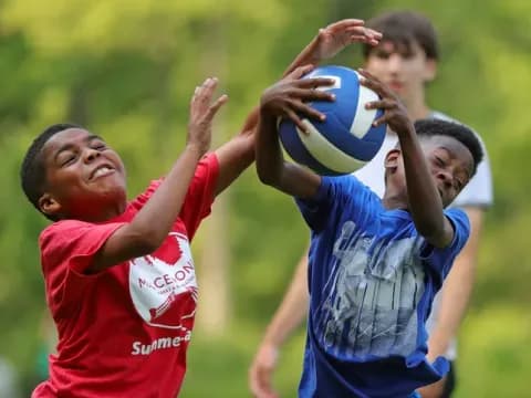 a group of boys playing rugby
