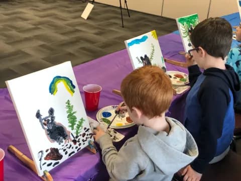 a group of people painting