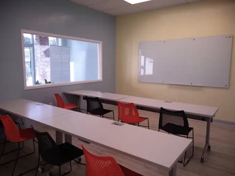 a room with a table and chairs