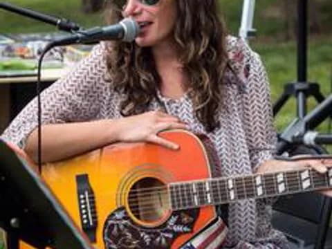 a person playing a guitar