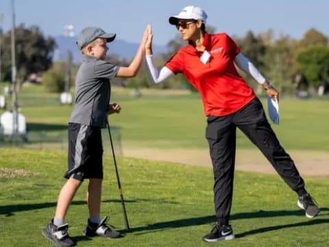 a man and a woman playing golf