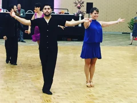 a man and woman dancing