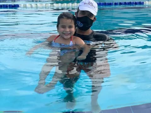 a man and woman in a pool