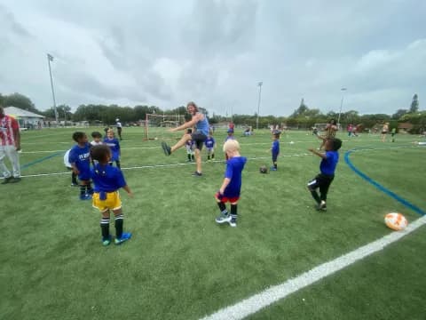 a group of kids playing football