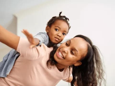 a person holding a child