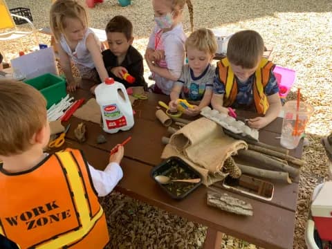 a group of children painting