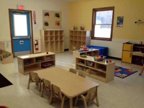 a room with a table and chairs