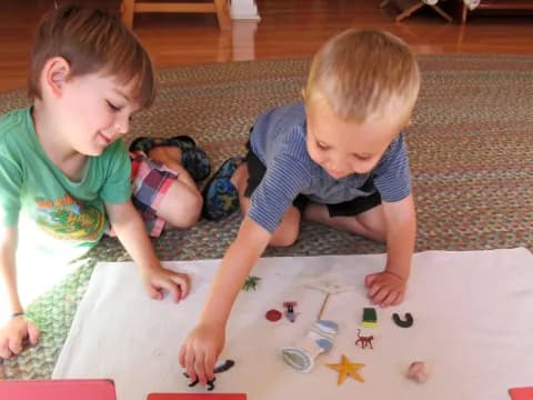 two children playing with a puzzle