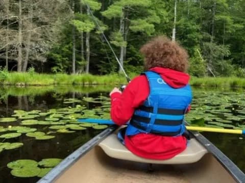 a person in a kayak on a river