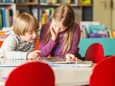 a boy and girl studying