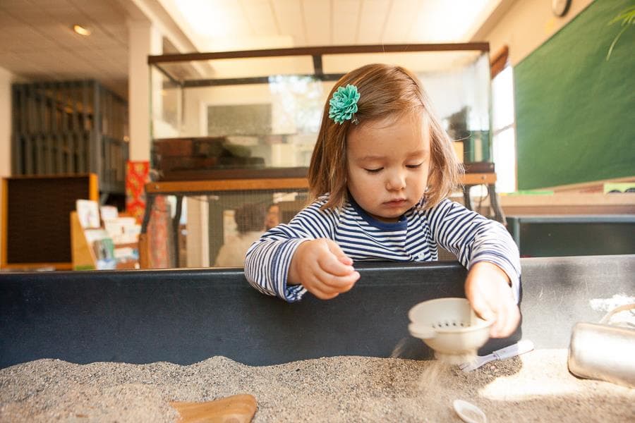 a girl sitting at a table