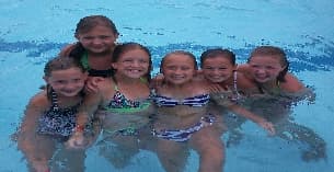 a group of people in a pool