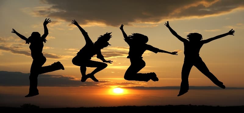 a group of people jumping in the air
