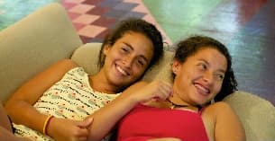 a man and woman lying on a couch