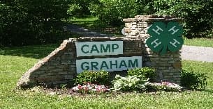 a sign on a stone wall