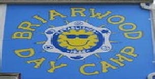 a sign with a cartoon face