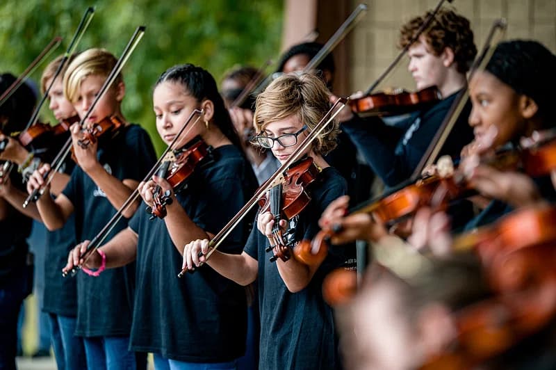 a group of people playing instruments