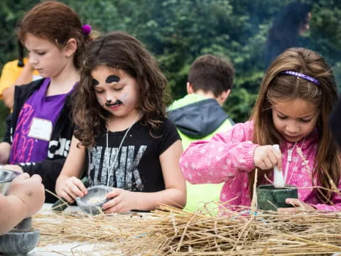 a group of children painting