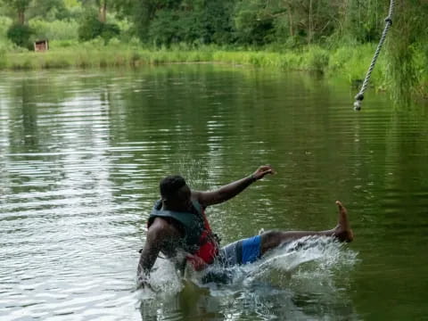 a man riding a water ski
