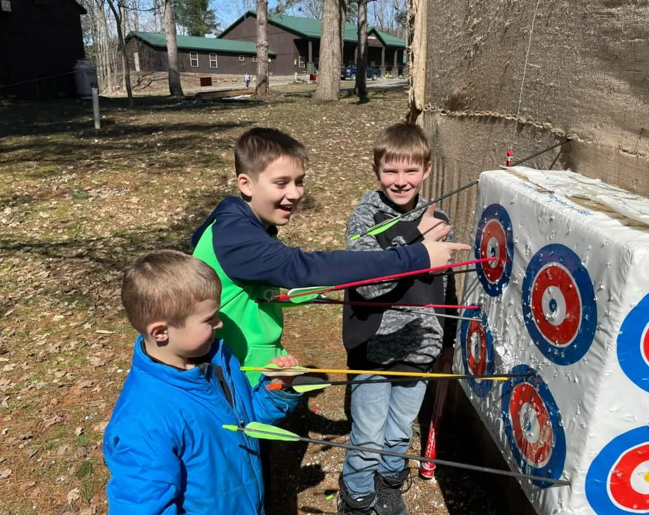 a group of boys playing with a toy