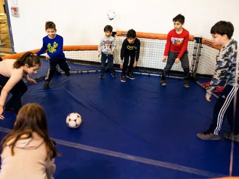 a group of kids playing football