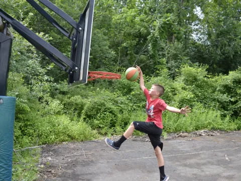 a boy playing with a ball