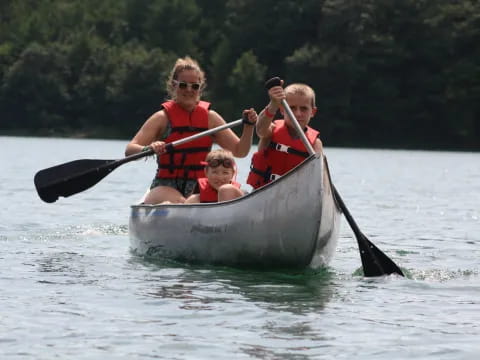 a group of people in a canoe