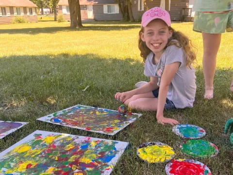 a girl sitting on the grass