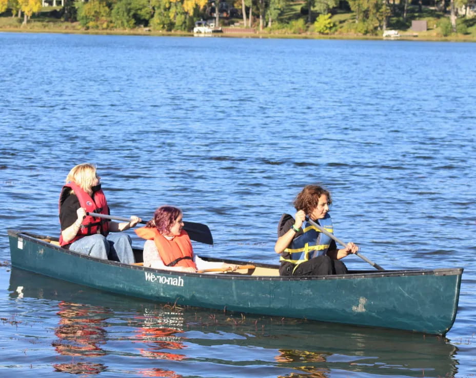 a group of people in a canoe