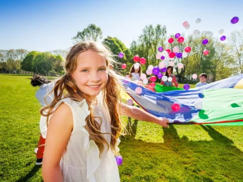 a girl holding a kite