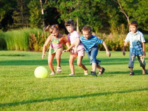 kids chasing a ball