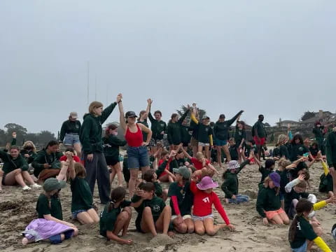 a group of people on a beach