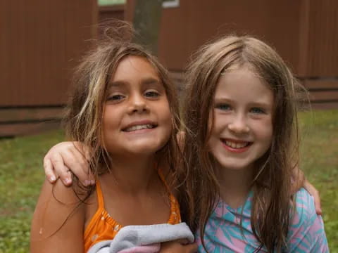 two girls smiling for a picture