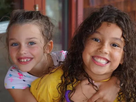 a couple of girls smiling