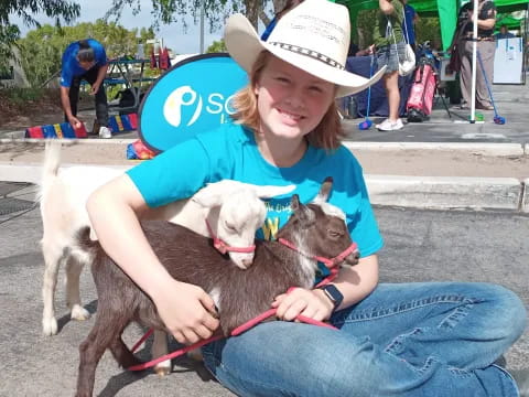 a person holding a couple dogs