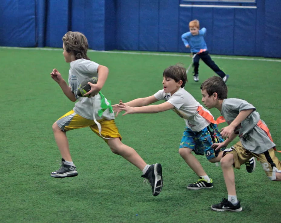 a group of boys playing rugby