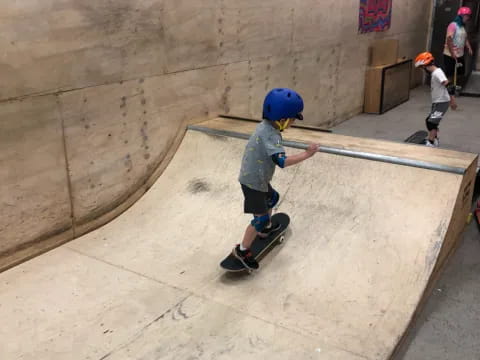 a kid skating on a ramp