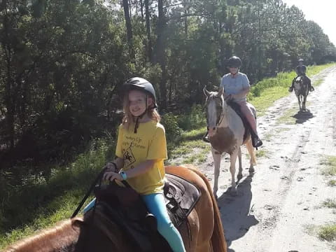 a group of people riding horses