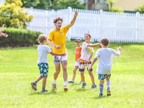 a group of kids playing football
