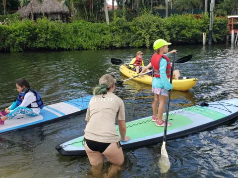 a group of people in kayaks