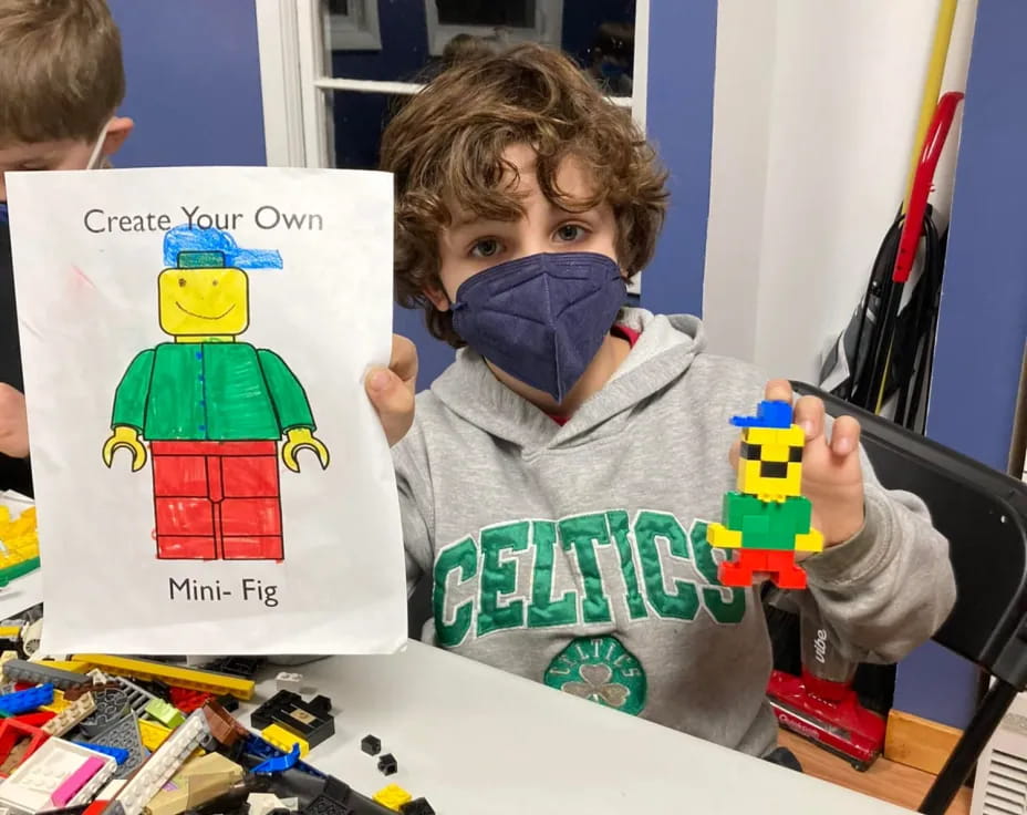 a boy holding a book