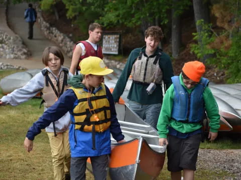 a group of people in vests